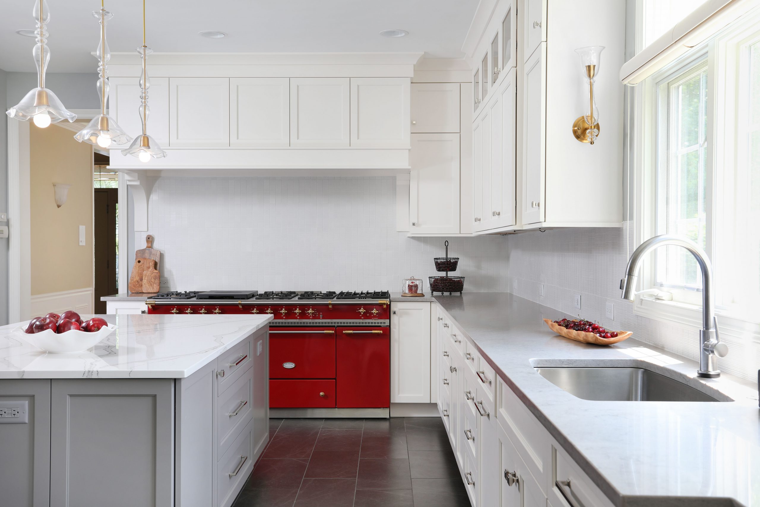 White and gray kitchen with red appliances