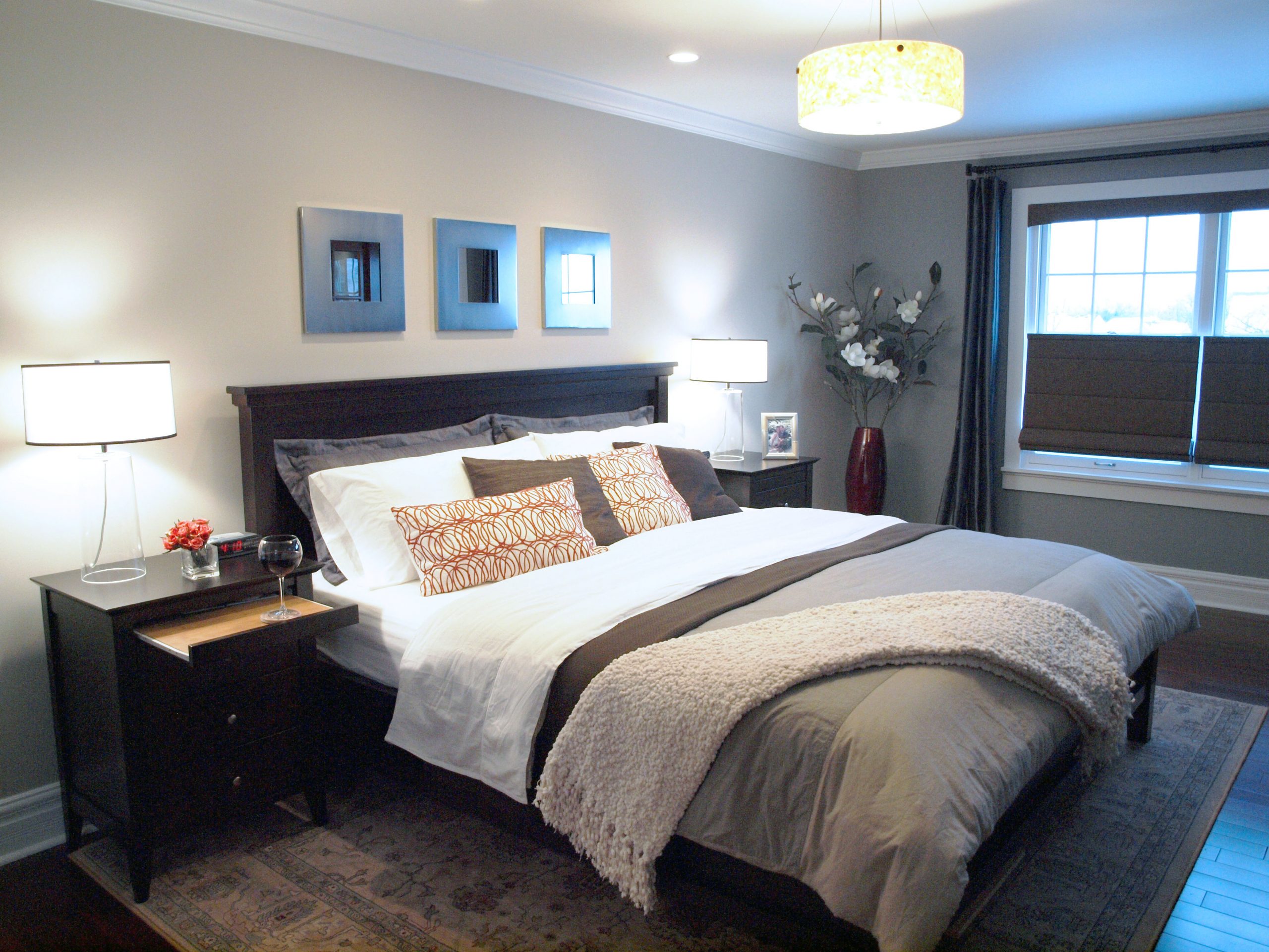 Primary bedroom with wine glass on night stand