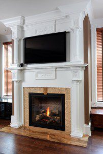 Traditional style fireplace with TV above