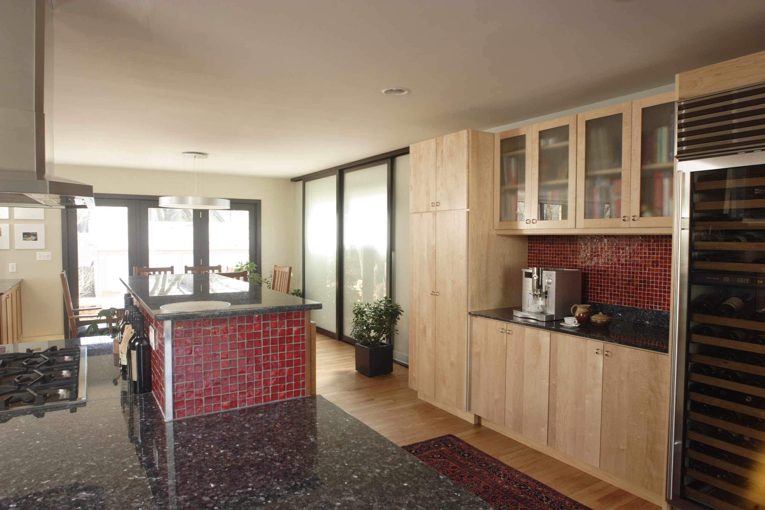 modern kitchen with red accent tile