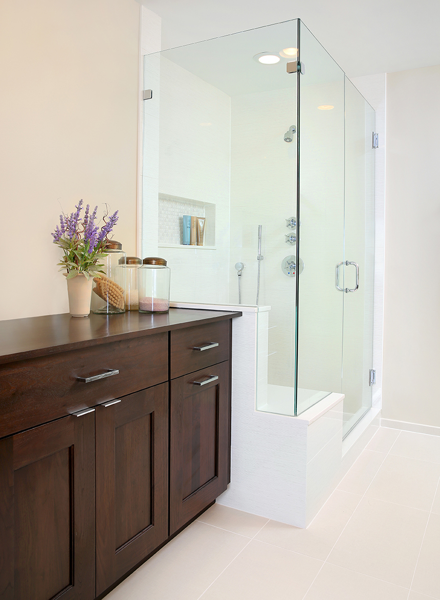 Primary bathroom shower with storage