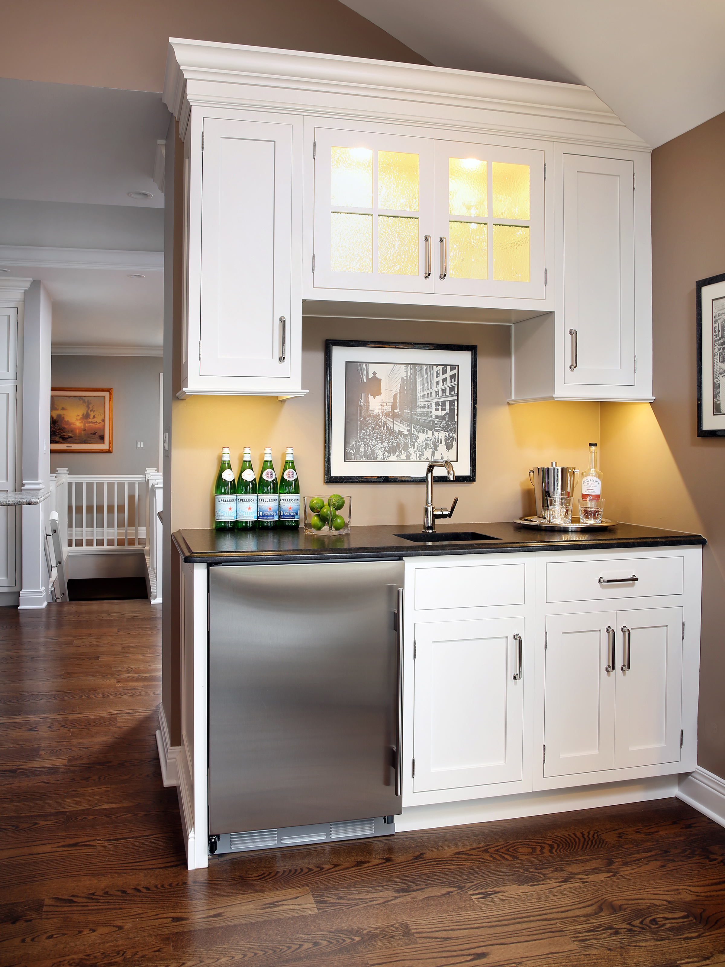 Wet bar in living room that coordinates with kitchen