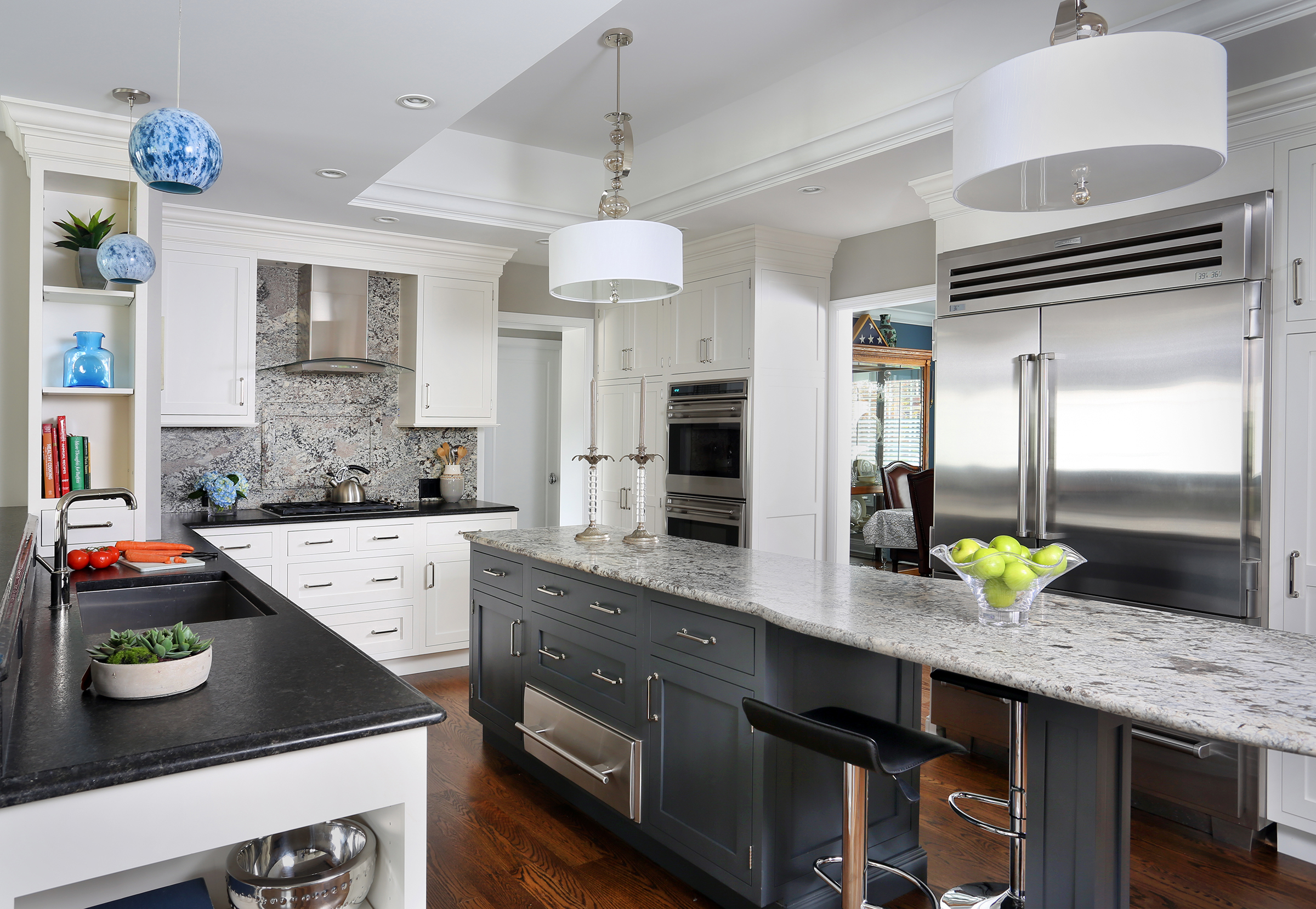 White painted kitchen with dark painted island