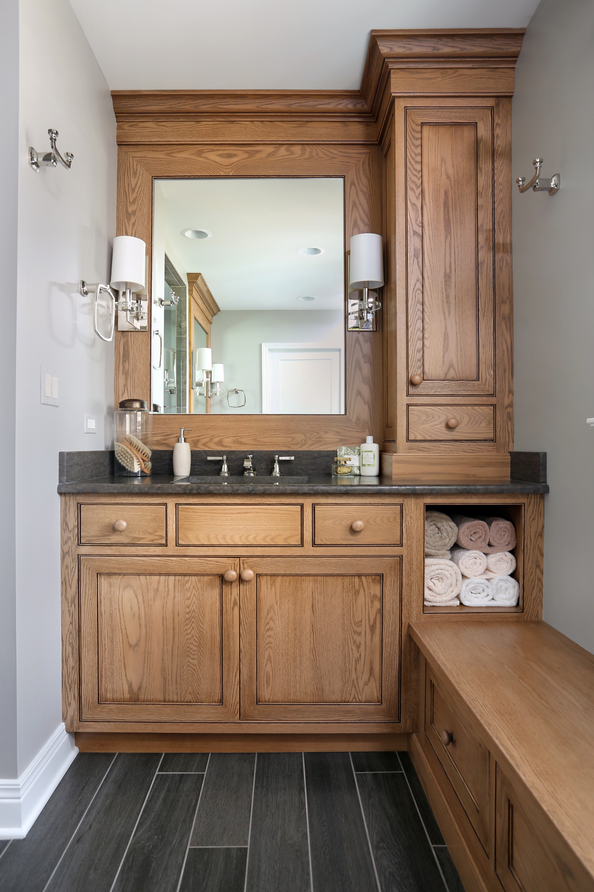 Stained bathroom vanity with both open and concealed storage