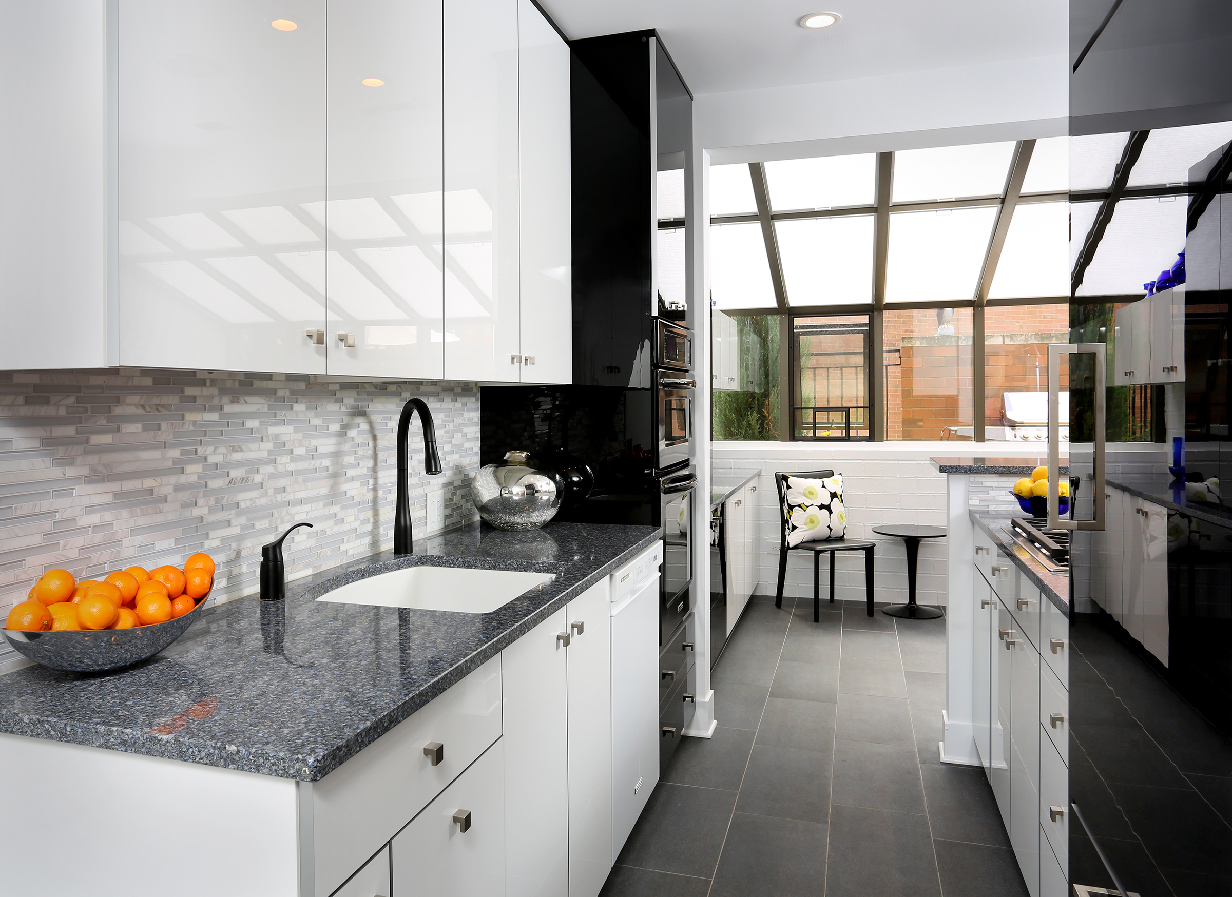 Galley kitchen with high gloss cabinets