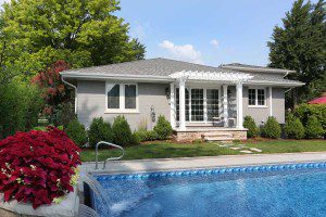 Backyard pergola and in-ground swimming pool