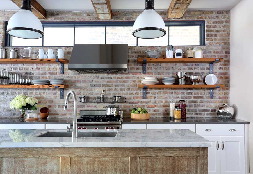 white and stained kitchen cabinets with reclaimed wood shelves and exposed brick