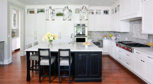 Traditional white kitchen with dark stained island