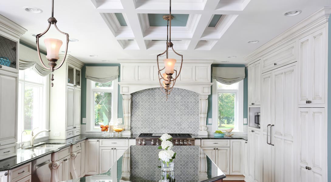 White painted kitchen cabinets with a coffered ceiling and robin's egg blue paint on the walls