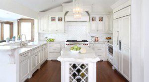 U-shaped kitchen with small island and vaulted ceiling