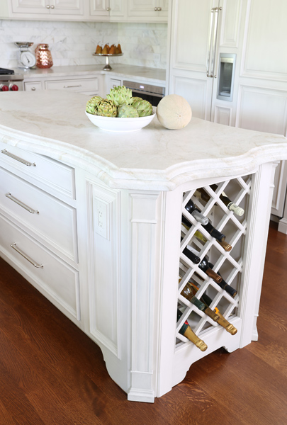 kitchen island with wine storage and contoured countertop