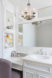 "hers" side of the master bathroom vanity includes sink and makeup table