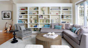 book cases line the wall of this living room