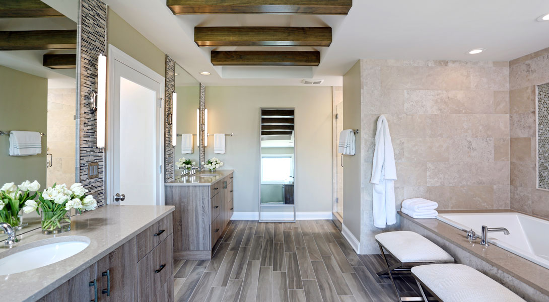 spa inspired master bathroom with two vanities and ceiling beams