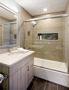 Full bathroom adjoining a kids bedroom with toilet, vanity and combination tub/shower