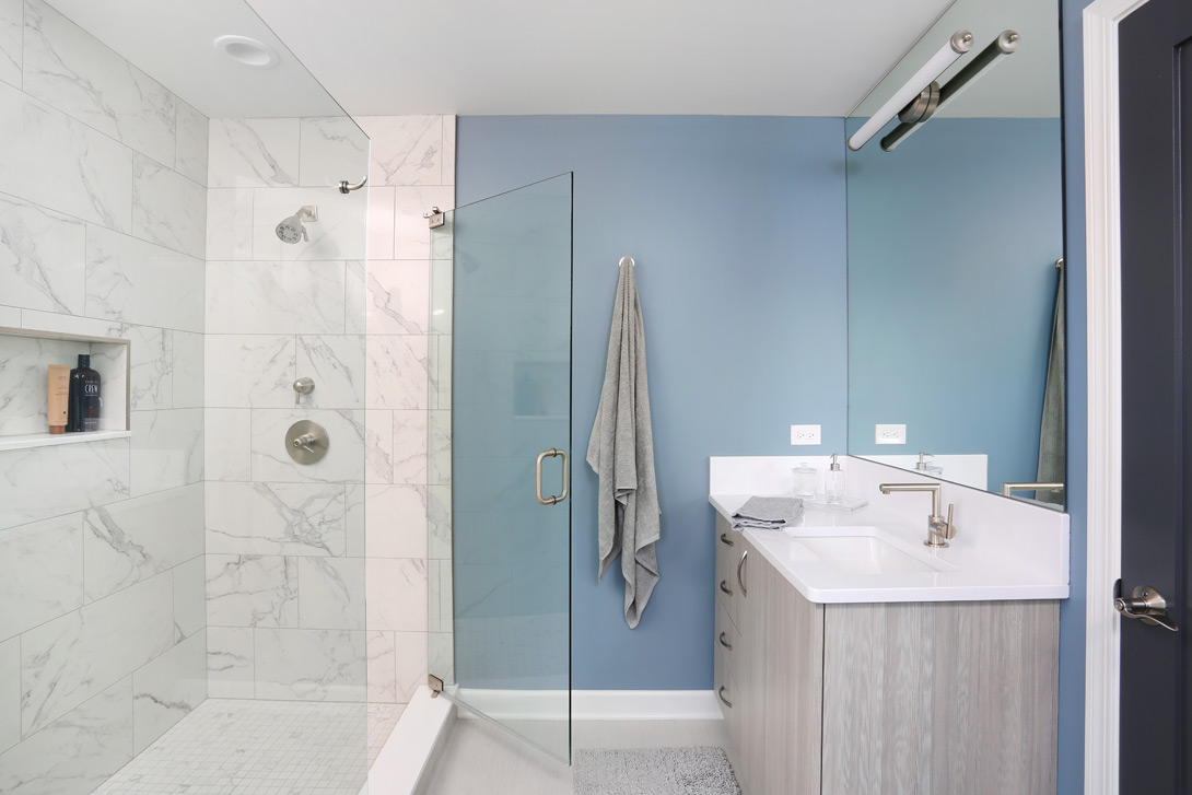 master bathroom with two vanities and oversized luxury shower