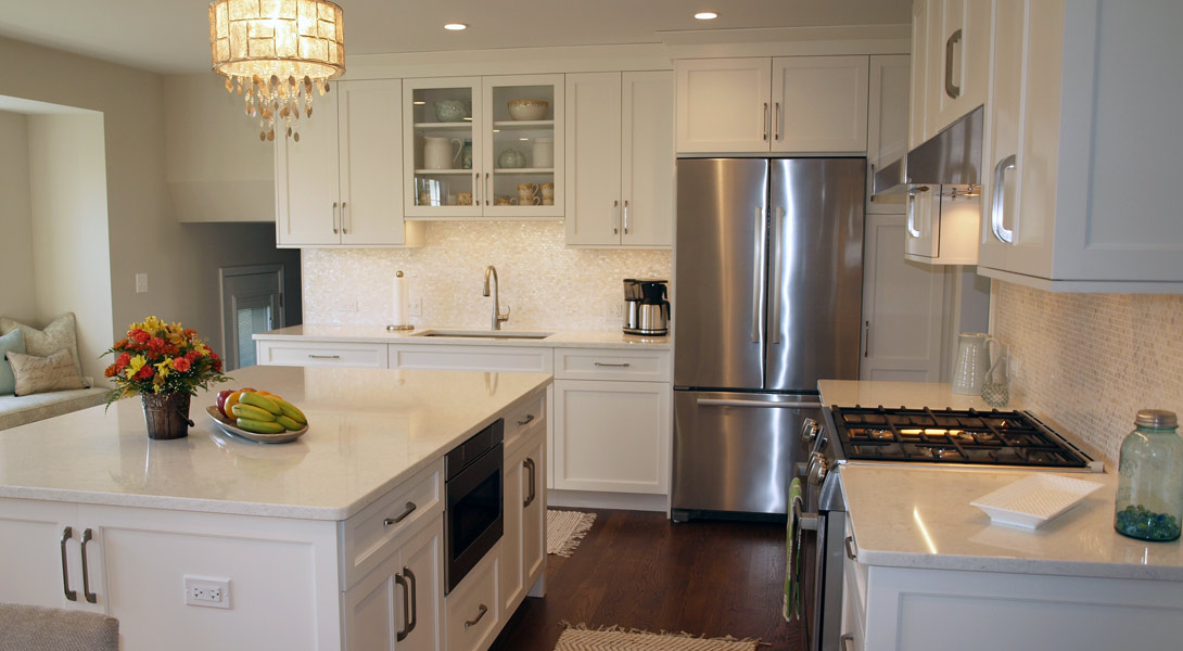 White on white kitchen with island and window seat