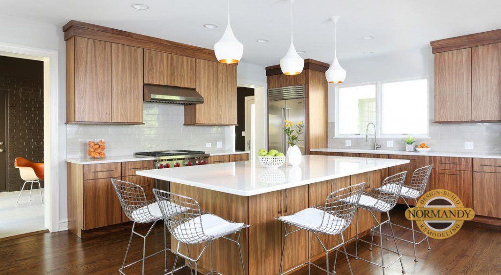 modern stained kitchen with wood tones and large island with seating