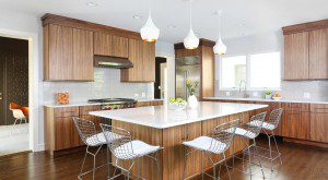 modern stained kitchen with wood tones and large island with seating