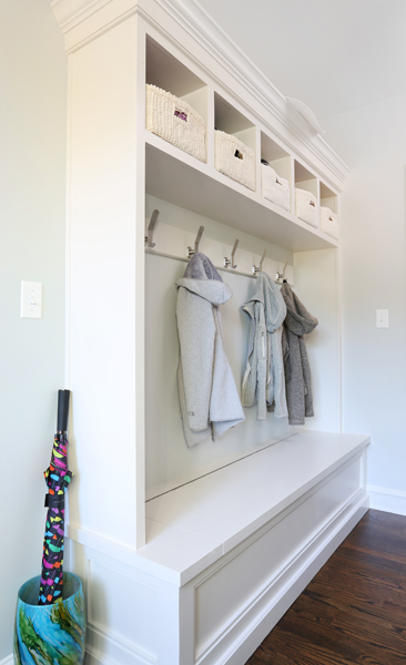 mudroom cabinetry with hooks for jackets and cubbies for personal effects