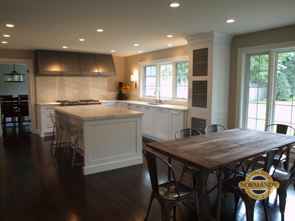 white kitchen with island and open floorplan