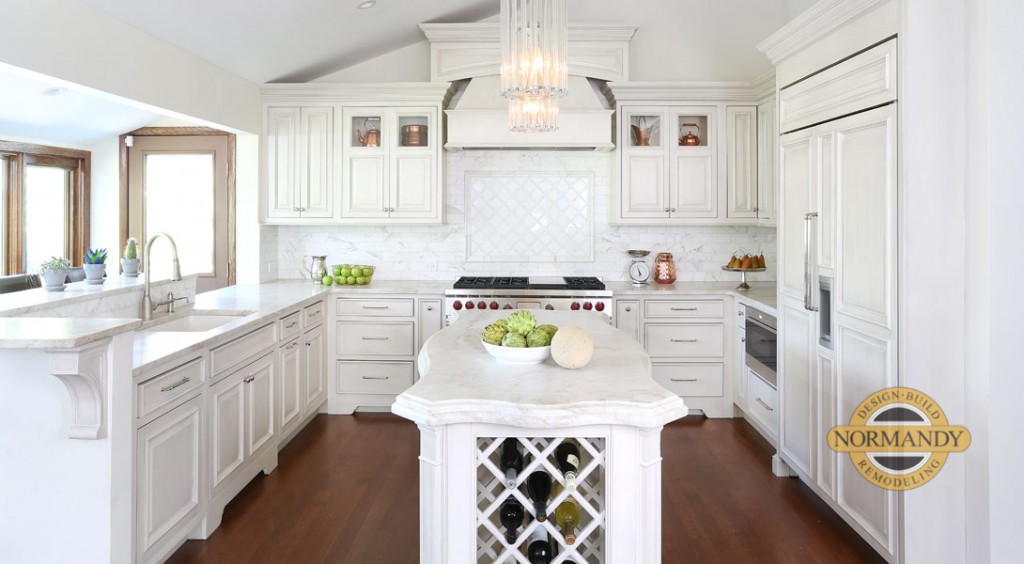 U-shaped kitchen with small island and vaulted ceiling