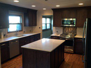 kitchen remodeled with dark stained cabinets