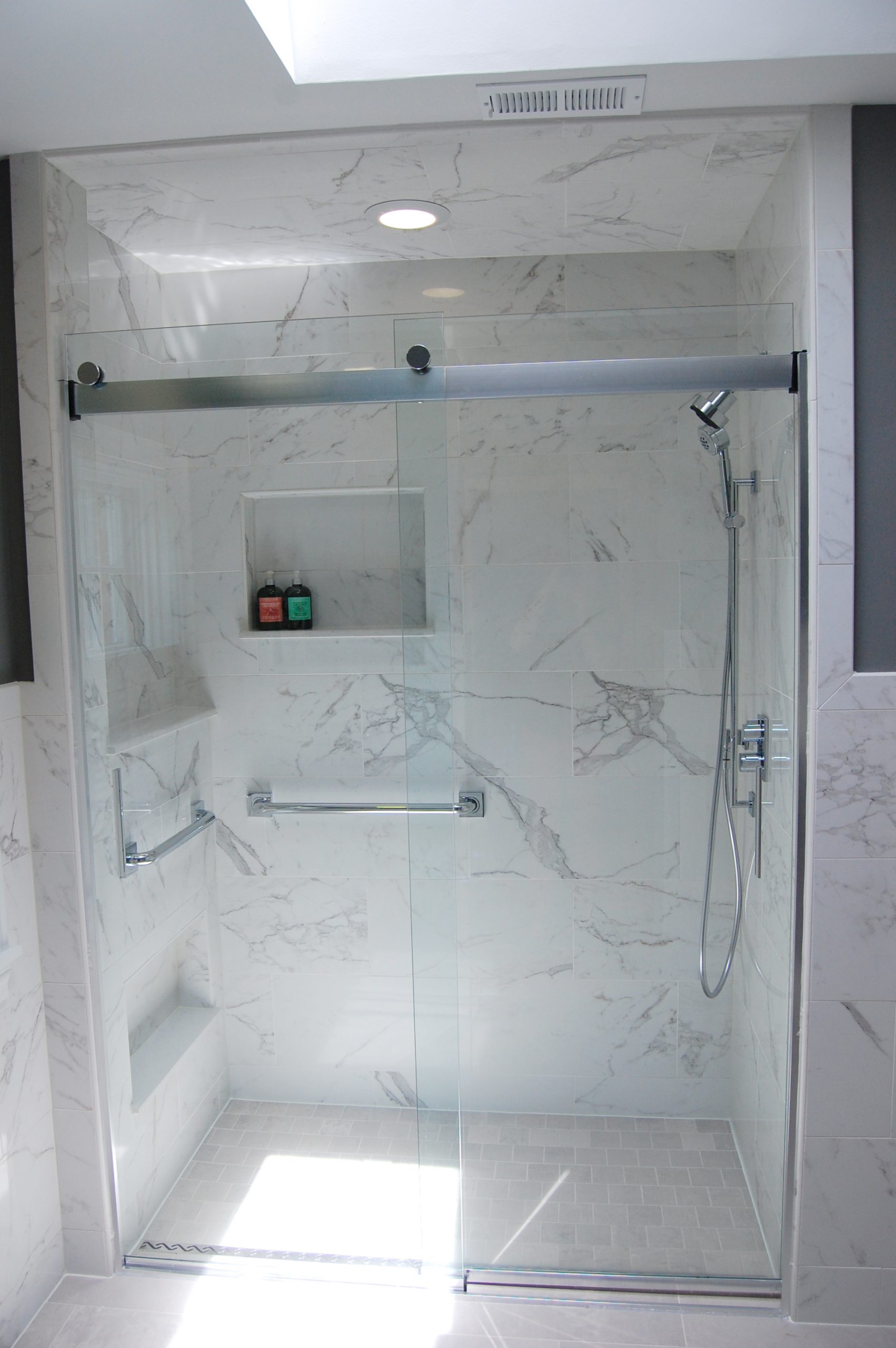 Shower with glass door and niche storage