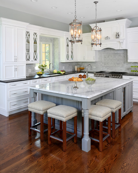 white kitchen island with stainless steel top