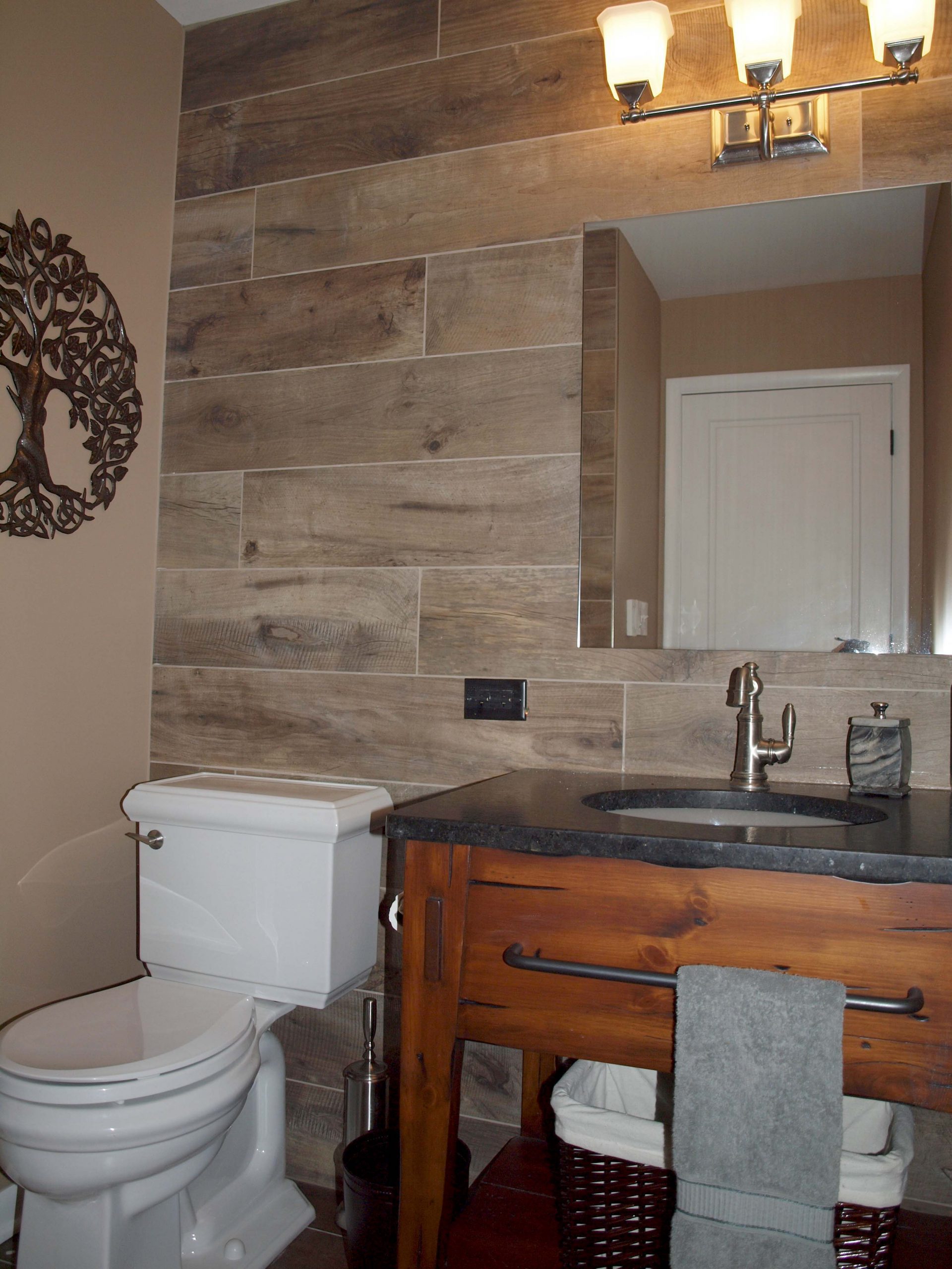 Vanity, toilet, sink and wood-look wall tile