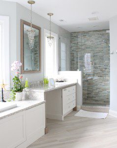 Master bathroom with drop-in bathtub, makeup vanity, and walk-in shower