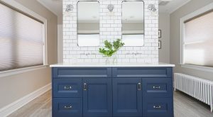 Navy blue cabinets in master bathroom