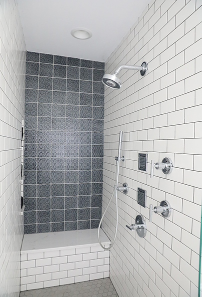 Shower with navy blue accent wall tile