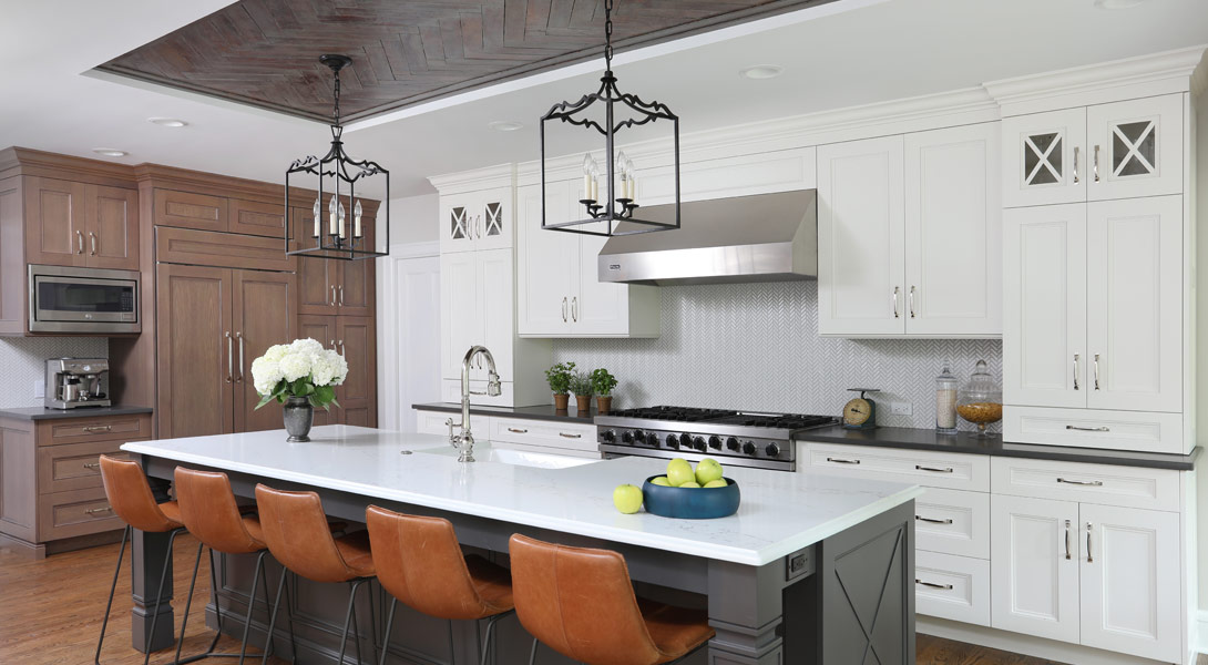 White and gray painted cabinets with stained kitchen cabinets