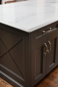 X design at the end of island cabinetry