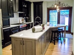 Large Center island, wood storage under cabinets, sliding glass entry door