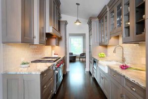 Stained wood cabinets in galley kitchen