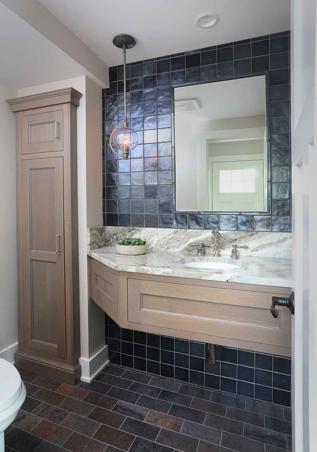 Gray stained powder room cabinets with extra storage