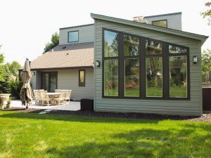 Sunroom addition peaked roof wall of windows