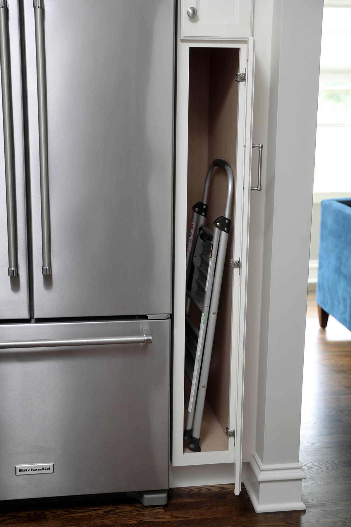 White storage cabinetry, slim cabinet