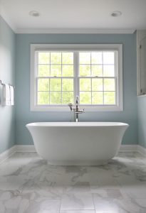 Large soaking tub, porcelain tile, natural light