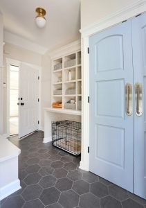 Mudroom with cubbies and a space for a dog crate