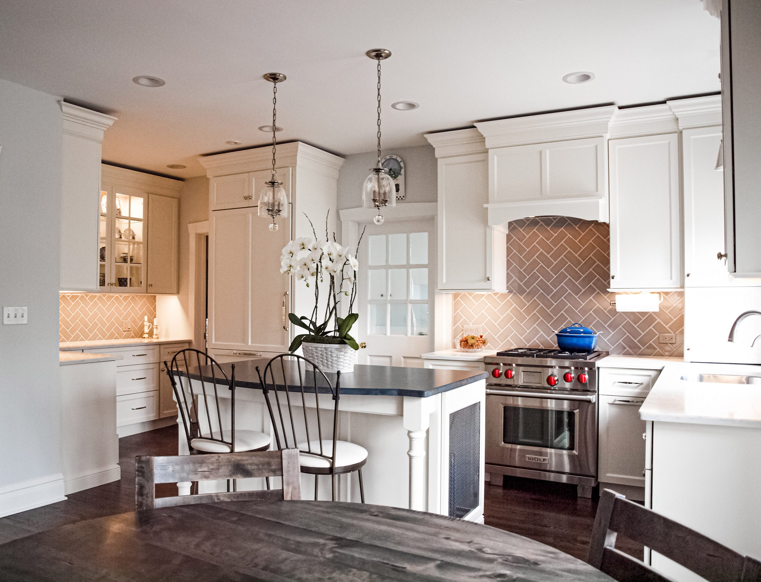 white kitchen cabinetry with small island