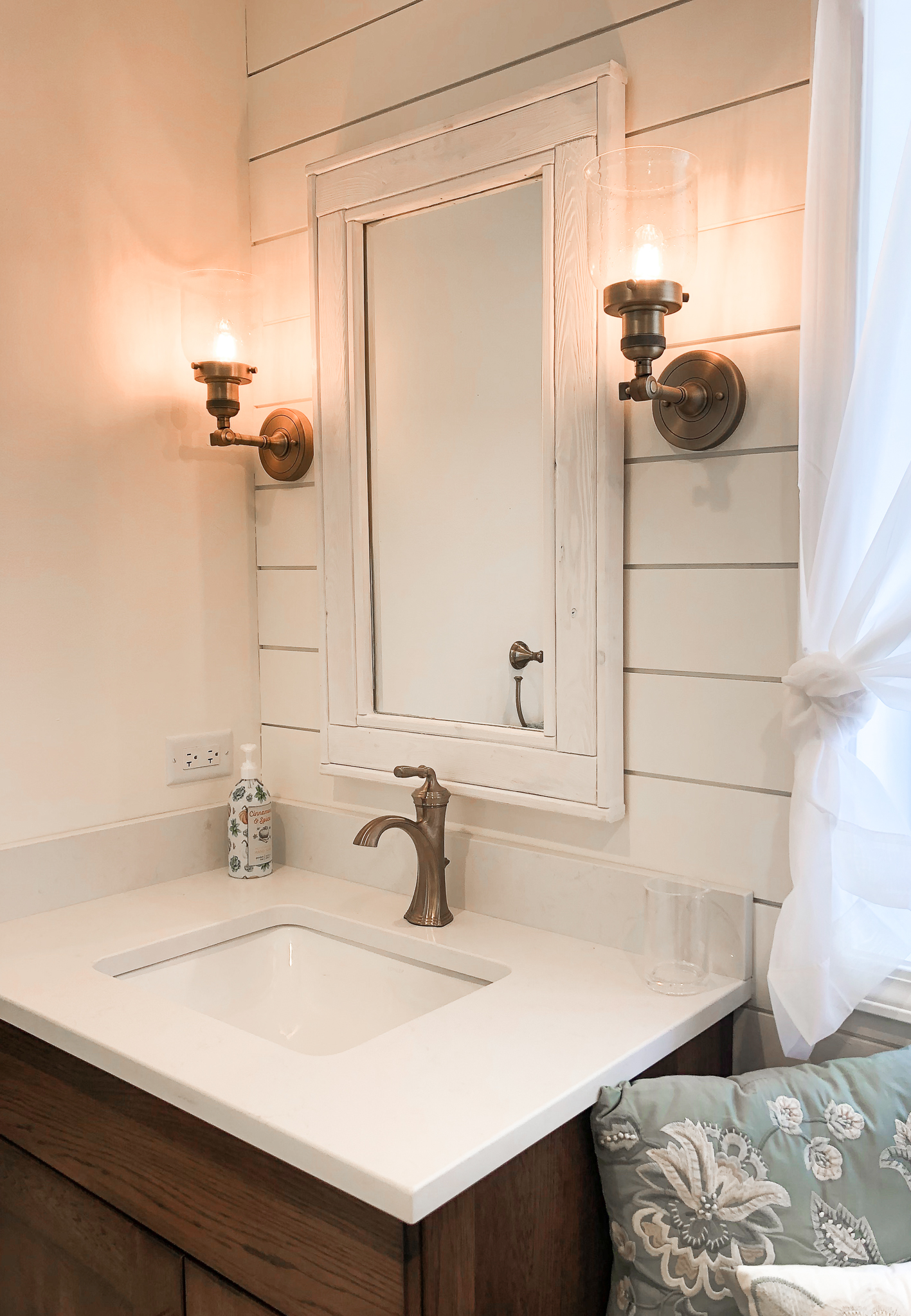 farmhouse bathroom with shiplap wall