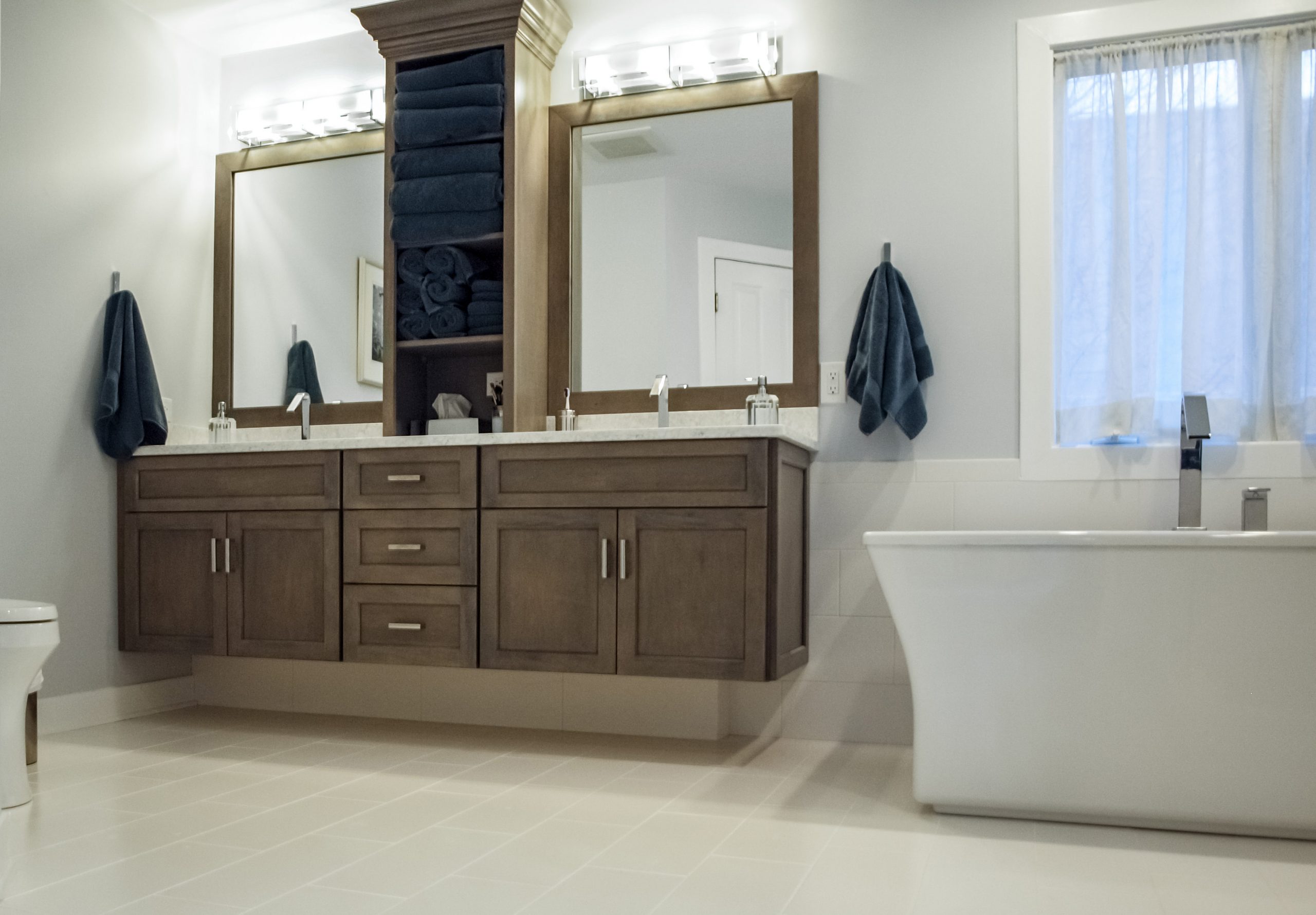 his & hers floating vanity and square tub