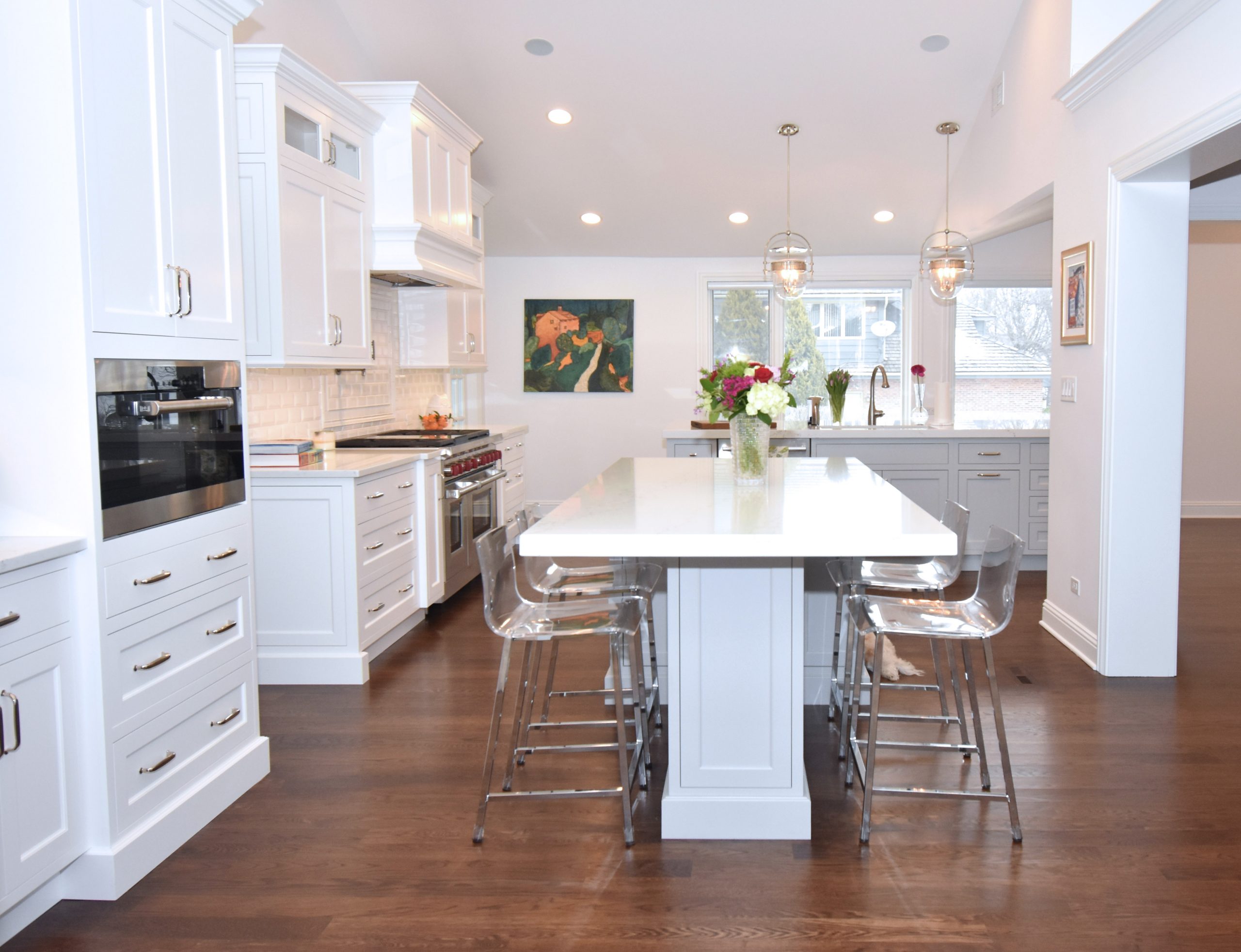 Large white kitchen with two islands