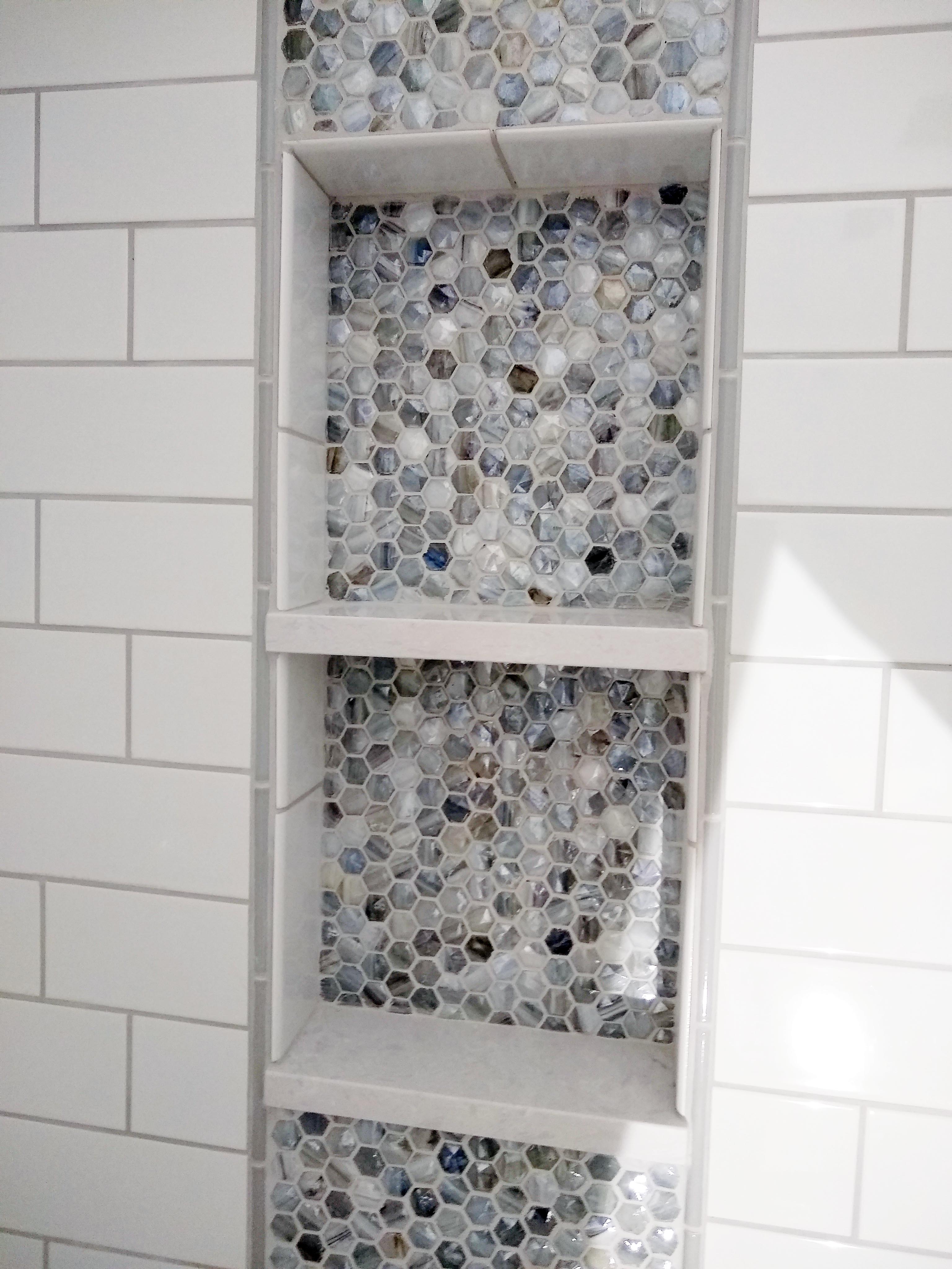 decorative tile in shower niche