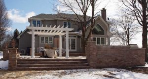 Exterior of the home with a pergola