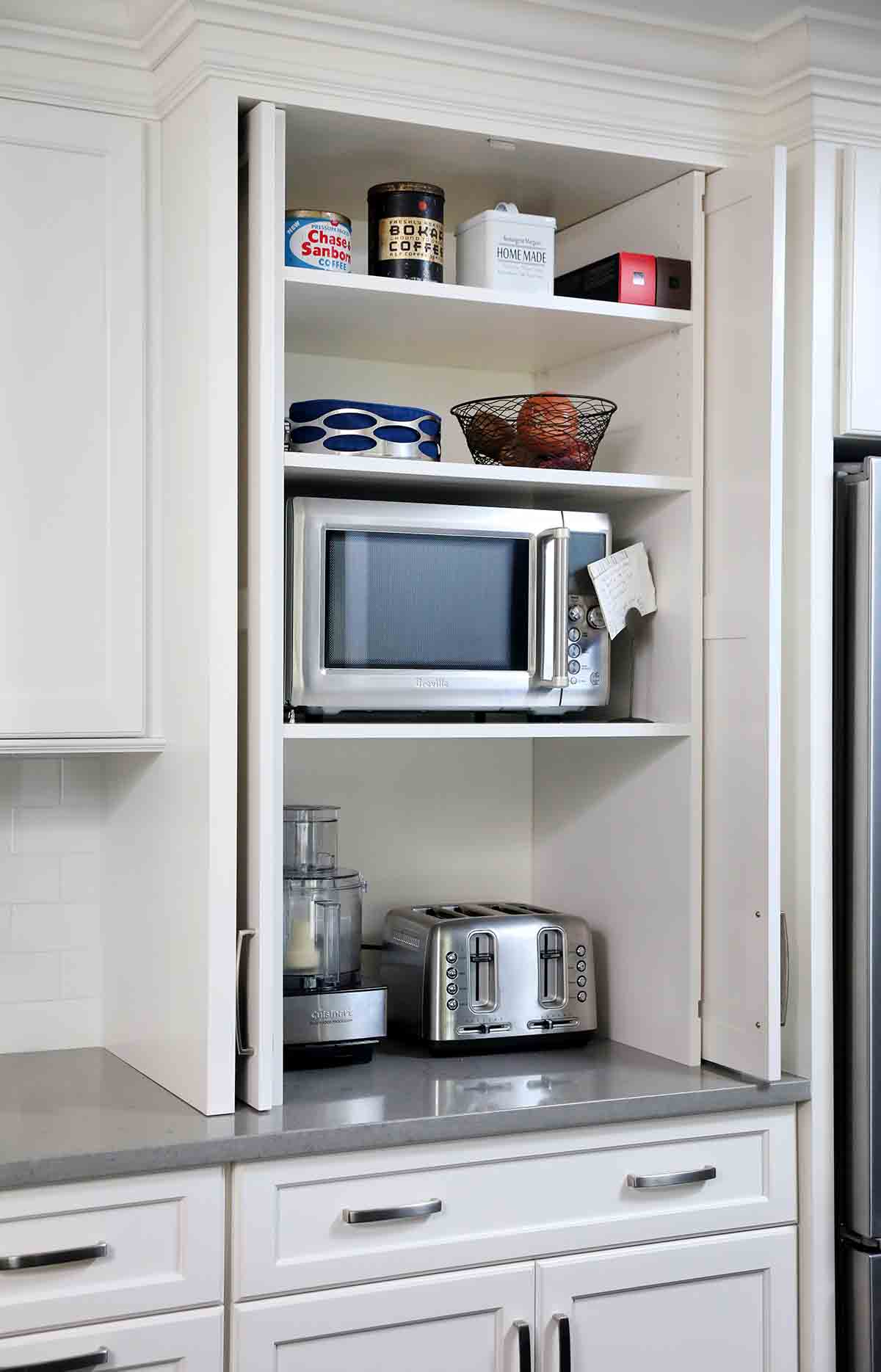 appliance garage with pocket doors