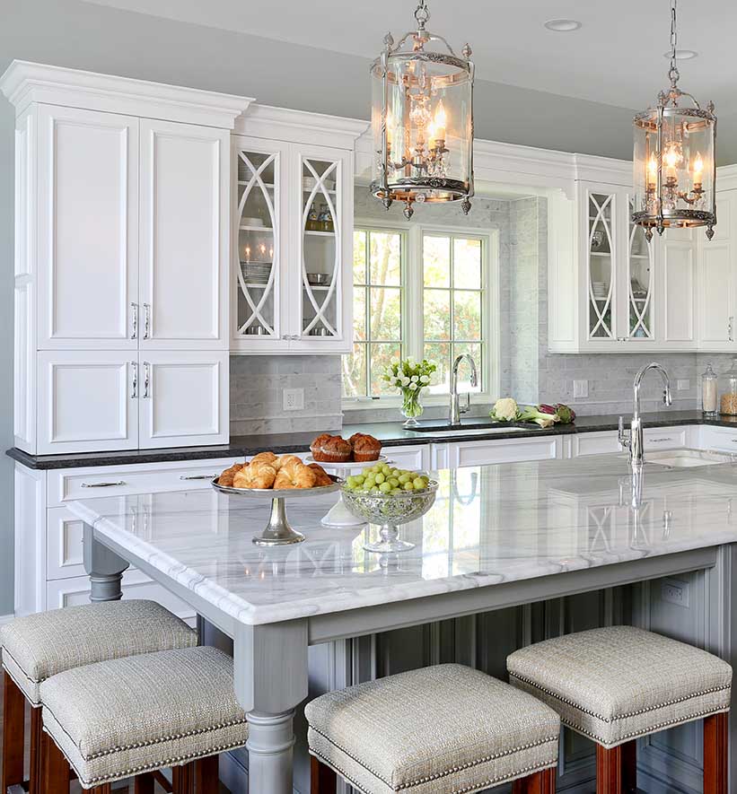 White kitchen with cabinets that go to the counter